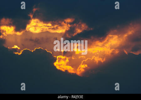 Fiery break in the dark clouds Stock Photo