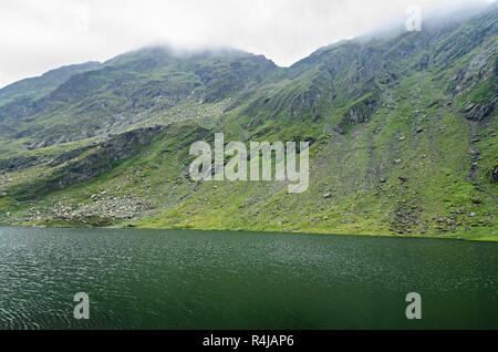 The glacier lake called Balea (Balea Lac) on the Transfagarasan road from Fagaras mountains. Stock Photo