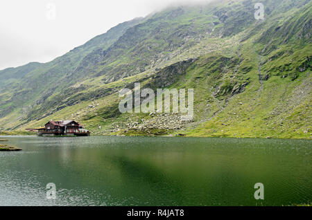 The glacier lake called Balea (Balea Lac) on the Transfagarasan road from Fagaras mountains. Stock Photo