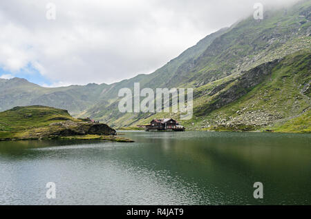 The glacier lake called Balea (Balea Lac) on the Transfagarasan road from Fagaras mountains. Stock Photo