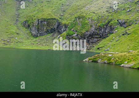 The glacier lake called Balea (Balea Lac) on the Transfagarasan road from Fagaras mountains. Stock Photo