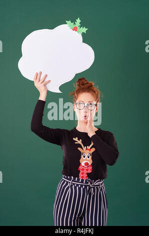 Girl holding speech bubble at studio shot Stock Photo