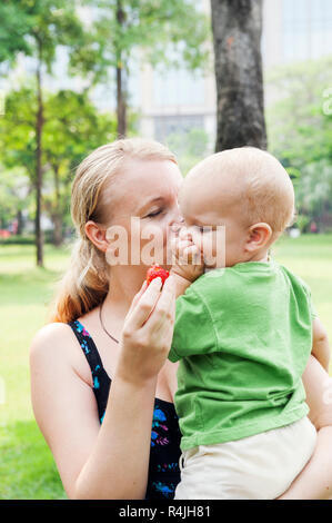Mother kissing son´s cheek
