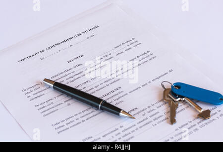 Spanish Lease / Rental agreement document with keys and pen. Stock Photo