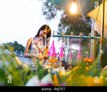 Woman buying flower at hawker in thailand Stock Photo