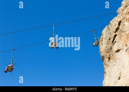 Needles Chairlift cables and cable cars near the top of the cliffs above Alum Bay Cliffs. Chairlift takes visitors to the beach & the bay. Isle of Wight. UK (98) Stock Photo