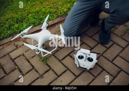 UFA, RUSSIA - 11 JULY 2018: Drone DJI Phantom 4. Quadrocopter against the blue sky with white clouds. Stock Photo