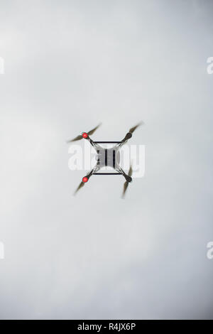 UFA, RUSSIA - 11 JULY 2018: Drone DJI Phantom 4. Quadrocopter against the blue sky with white clouds. Stock Photo