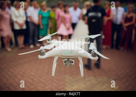 UFA, RUSSIA - 11 JULY 2018: Drone DJI Phantom 4. Quadrocopter against the blue sky with white clouds. Stock Photo