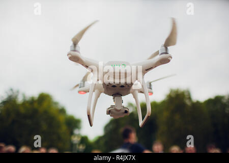 UFA, RUSSIA - 11 JULY 2018: Drone DJI Phantom 4. Quadrocopter against the blue sky with white clouds. Stock Photo