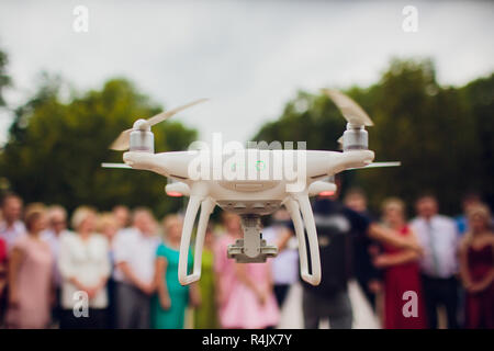 UFA, RUSSIA - 11 JULY 2018: Drone DJI Phantom 4. Quadrocopter against the blue sky with white clouds. Stock Photo