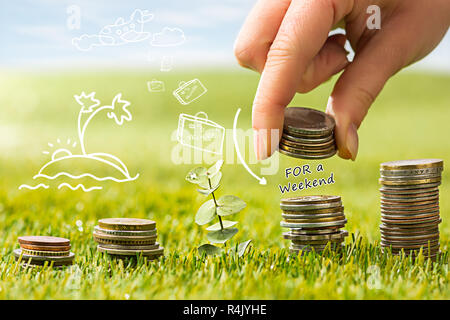 The columns of coins on grass Stock Photo