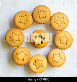 Gingerbread fruit mince pies with a star shape on the pastry lids. Stock Photo