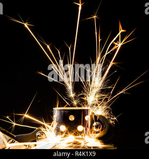sparks from the gasoline lighter against a dark background Stock Photo