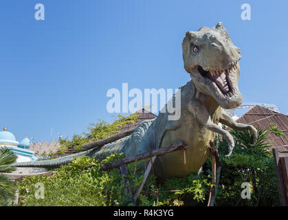 Castelnuovo del Garda, Italy - Agust 31 2016:  Dinosaur statue Yrannosaurus-rex Gardaland Theme Amusement Park in Castelnuovo Del Garda, Verona, Italy Stock Photo