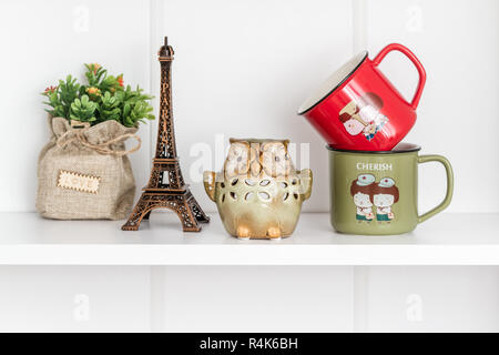 Decorative Green Owl Candles on White Shelf Stock Photo