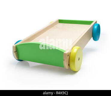 Wooden carriage toy with colorful wheels in braking action. Stock Photo