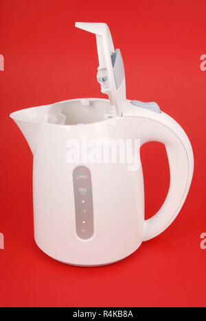 White electric kettle isolated on red background Stock Photo