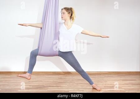 yoga aerial yoga yoga air. yoga on the horn. yoga exercises yoga positions. yoga. antigravity yoga. Stock Photo