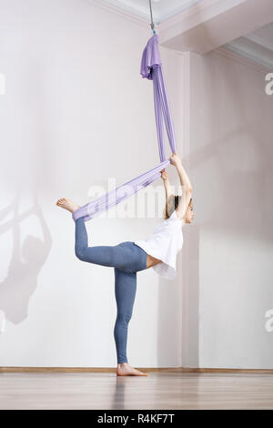 yoga aerial yoga yoga air. yoga on the horn. yoga exercises yoga positions. yoga. antigravity yoga. Stock Photo