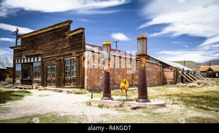 Old gas station in abandoned ghost town Bodie with bullet holes on gasoline sign, California , California Stock Photo