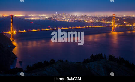 The Golden Gate Bridge at night with San Francisco in the distance Stock Photo