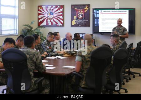 U.S. Marine Corps Col. Aaron Brunk, left, Joint Exercise Support Group ...