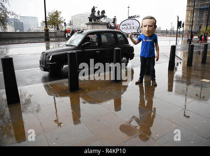 An actor dressed as Mark Zuckerberg arrives at Portcullis House, London, where a hearing is taking place on the impact of disinformation on democracy. Stock Photo