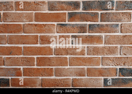 Decorative interior brick wall painted in black and bronze Stock Photo