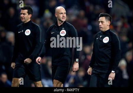 Match referee Anthony Taylor (centre) with assistants Adam Nunn (left) and Gary Beswick Stock Photo