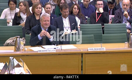 Facebook vice-president Richard Allan giving evidence to the Commons Culture Committee inquiry into fake news, with empty seat and nameplate left for founder Mark Zuckerberg at Portcullis House in London. Stock Photo