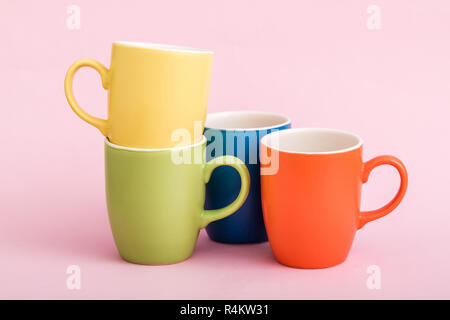 Colorful Coffee Mugs on Pink Background Stock Photo