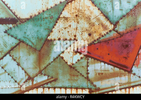 vintage rusty iron sheets wall textured background painted in green and red colours Stock Photo