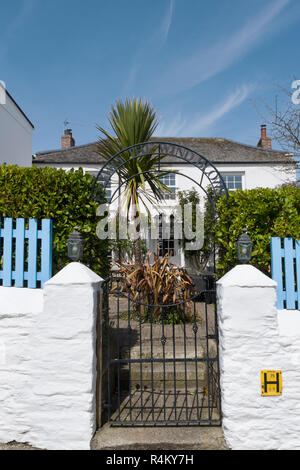 Any Way The Wind Blows written in iron over the gate of a house in Portscatho on the south coast of Cornwall, England, UK Stock Photo