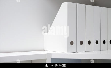 Office folders for documents. A folder with files on the sideboard in a bright modern office, archive and documents. Stock Photo