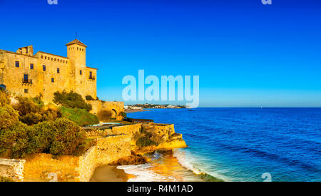 Cala Tobera bay with Tamarit castle overlooking the Mediterranean, Tarragona, Spain Stock Photo