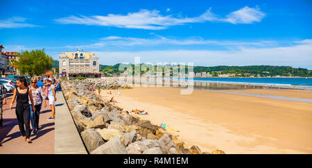 HENDAYE, FRANCE - JUNE 8: Tourists and surfers enjoy the beach of the charming seaside resort of Hendaye on June 8, 2017. Hendaye is located in the Py Stock Photo