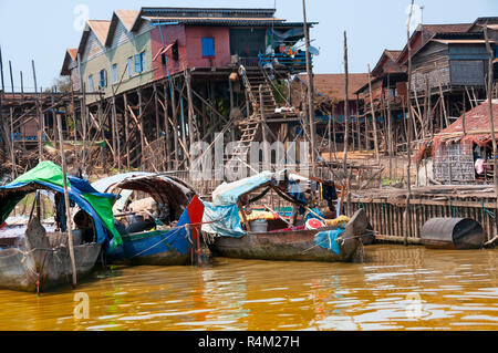 Stilt or stilted fishing village houses, in the dry season, situated on the banks of an estuary connecting it to Tonle Sap Lake,Cambodia Stock Photo