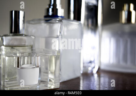 perfume bottles illumined with chiaroscuro light Stock Photo