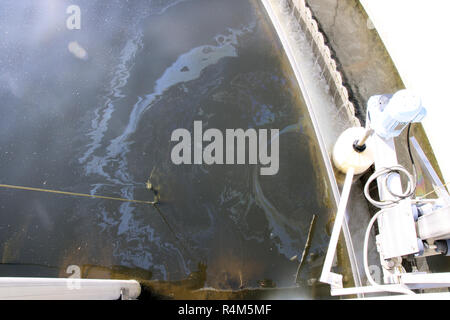 oil film in the settling tank of a sewage treatment plant Stock Photo