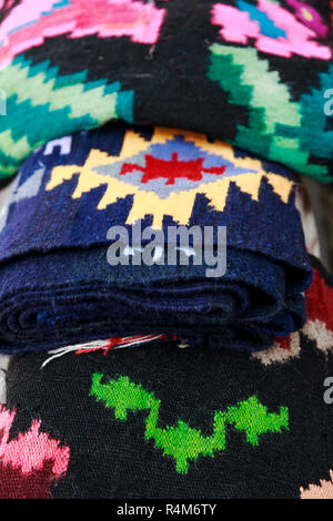 Close up of traditional handmade rugs from Romania with different colors and drawings Stock Photo