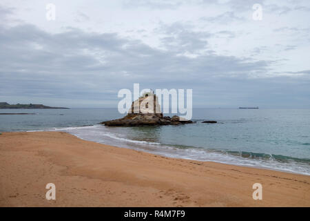 Rock in the beach of El Camello in Santander, Spain Stock Photo