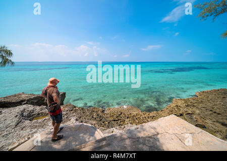 A tourist explores Santa Carolina Island, Bazaruto archipelago Mozambique. Stock Photo