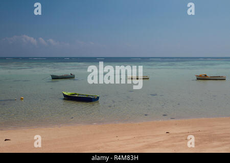 Sandy beach, boats and ocean. Mahe, Seychelles Stock Photo