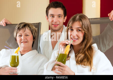 Wellness - People in Spa with Chlorophyll-Shake Stock Photo