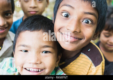 SAURAHA, NEPAL - APRIL 2015: portrait of Nepali boys looking into the camera in Chitwan national park. Stock Photo