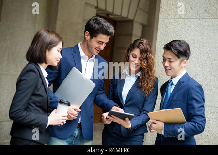 Group of business people working on tablet pc Stock Photo