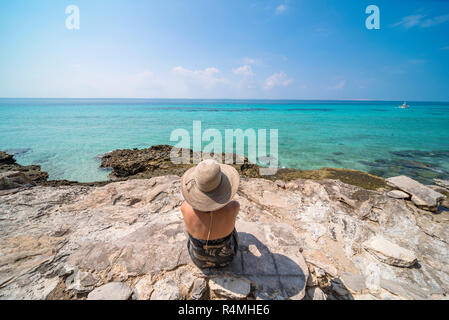 A tourist explores Santa Carolina Island, Bazaruto archipelago Mozambique. Stock Photo