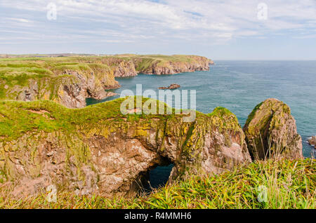 Bullers of Buchan refers to a collapsed sea cave situated about 6 miles south of Peterhead in Buchan, Aberdeenshire, Scotland. Stock Photo