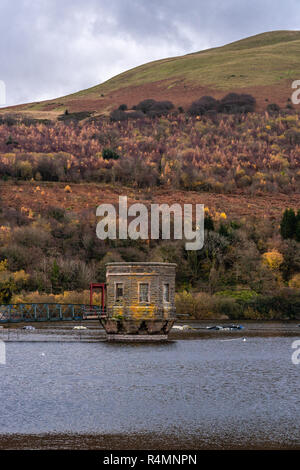 The reservoir valve tower at Talybont Reservoir in the Brecon Beacons National Park during autumn, Powys, Wales, UK Stock Photo